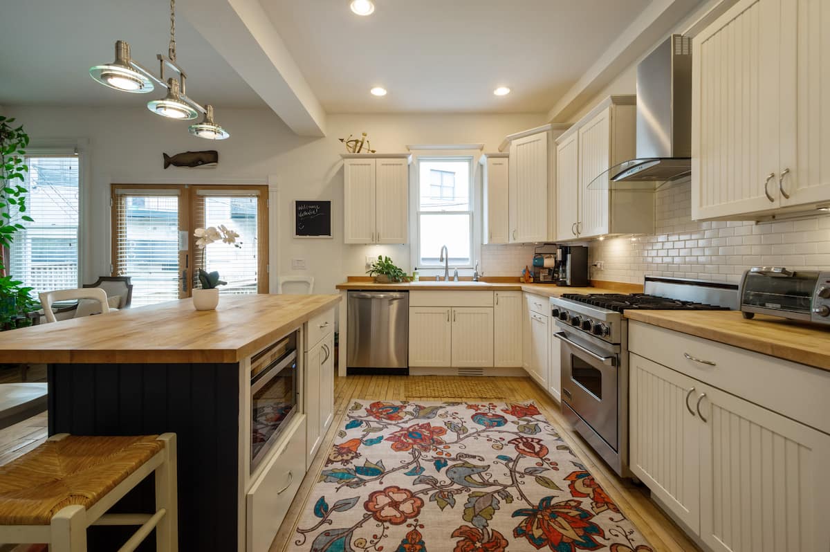 Kitchen with butcher block counters and a gas range