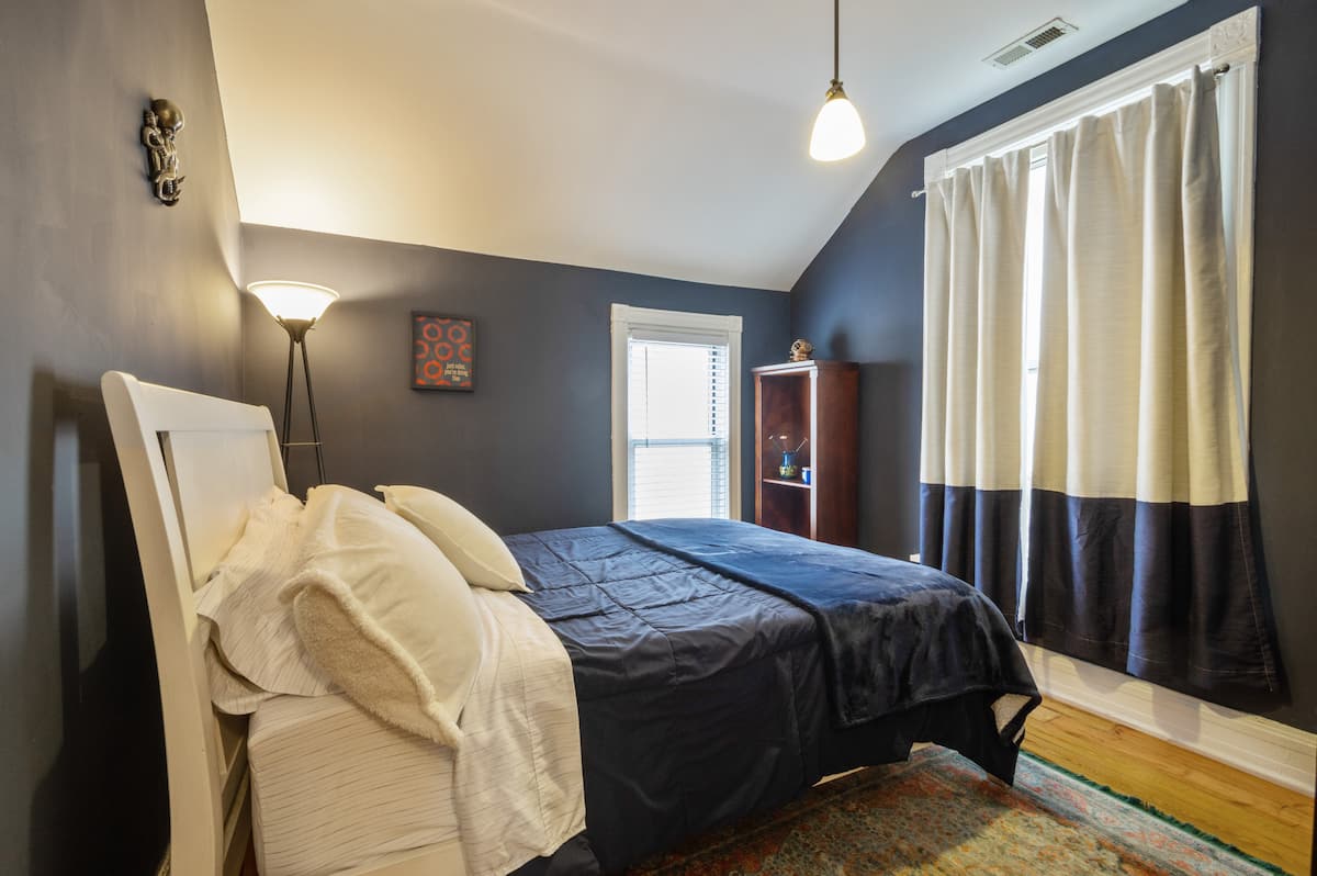 Bedroom with dark blue walls